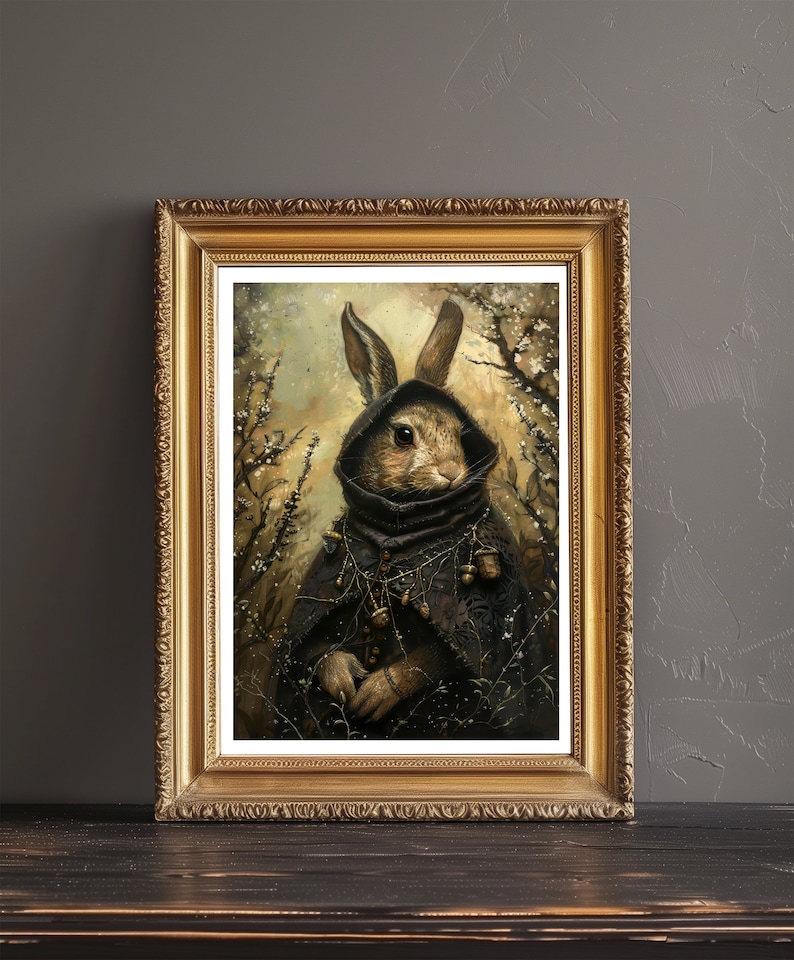 May include: A framed painting of a rabbit wearing a dark hooded cloak and holding a staff. The rabbit is surrounded by a forest scene with a soft, golden light.