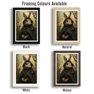 May include: Four different framing options for a print of a rabbit wearing a hooded cloak. The framing options are black, natural, white, and walnut.