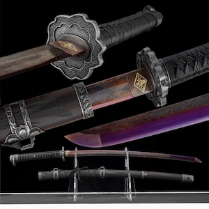 May include: An assortment of Japanese-style swords with ornate silver-colored guards and handles. The blades have a gradient of colors, including purple and brown. The swords are displayed on a clear stand against a black background.