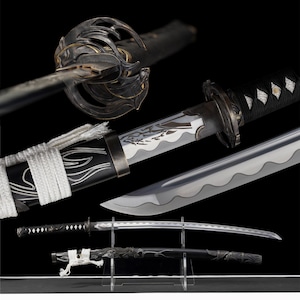 May include: A collection of Japanese katana swords, featuring intricate handle designs and sheaths. The blades are silver, and the handles are wrapped in black fabric. The sheaths are black with silver and white detailing. The swords are displayed on a clear stand against a black backdrop.