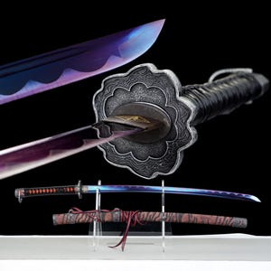 May include: A Japanese katana sword with a vibrant, iridescent blade. The sword features a decorative guard and a black handle. The scabbard is brown with a tiger stripe pattern. The blade is displayed on a clear stand.