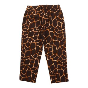 May include: Brown and tan animal print trousers. The trousers have a high waist and a straight leg. The pattern resembles a giraffe's coat. The trousers are made of a lightweight fabric, suitable for casual wear.