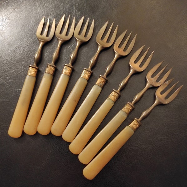 Antique brass shabby forks for dessert. Antique set of French brass forks from the beginning of the last century.