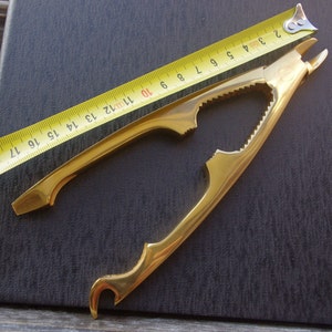 Solingen. Rare vintage gilded gripper to open sparkling wine - wire cutter - combination bottle opener - rare bar tool - nutcracker