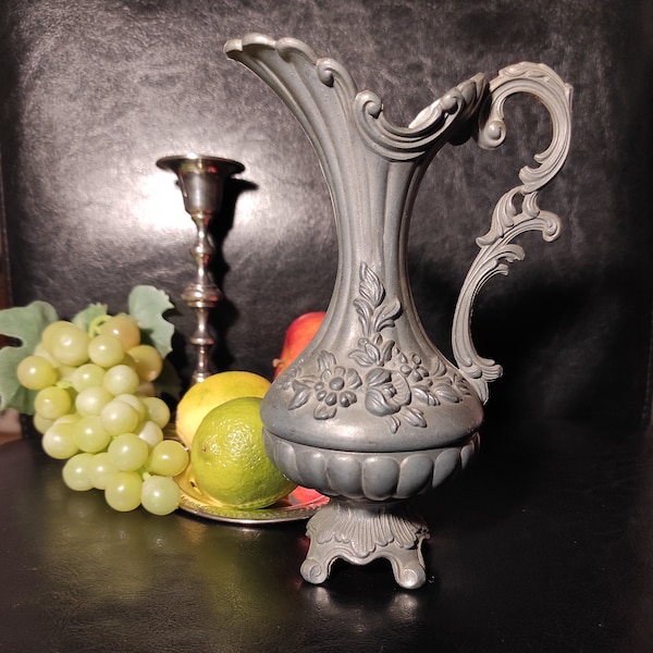 Antique small pewter jug. Old decorative jug for vintage decoration, for collection. Vintage jug for photo props.