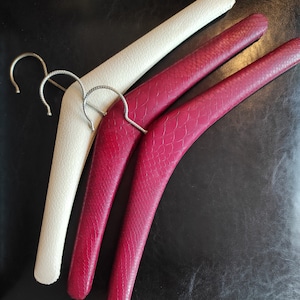 Set of three vintage wooden clothes hangers - three old clothes hangers are covered with &quot;reptile&quot; imitation leather