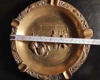 Large heavy (523 grams)Vintage brass ashtray. An old shabby large ashtray or trinket bowl with a medieval design - made of cast solid brass