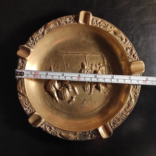 Large heavy (523 grams)Vintage brass ashtray. An old shabby large ashtray or trinket bowl with a medieval design - made of cast solid brass