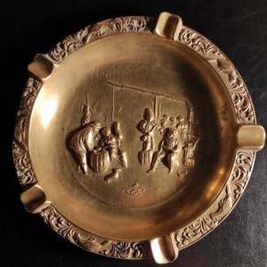 Large heavy (523 grams)Vintage brass ashtray/An old shabby large ashtray or trinket bowl with a medieval design - made of cast solid brass