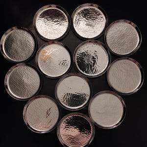 Set  12 Vintage German Silver Plated Hammered Coasters from the mid-20th century for serving and decorating vintage kitchen, bar, restaurant