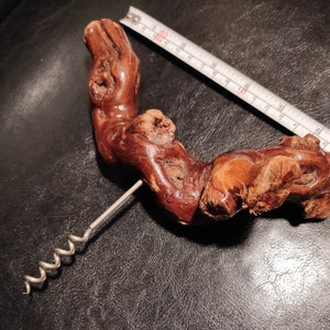 Vintage wooden corkscrew made from grapevine