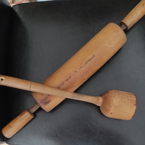 Large wooden old kitchen utensils- potato masher and wooden dough roller for vintage design of your kitchen, for display or for photo props