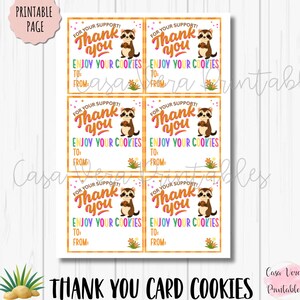 May include: Printable thank you card sheet with six cards. Each card has a raccoon holding a cookie, the text "Thank you", and "Enjoy your cookies". The cards are on a white background with the text "Thank You Card Cookies".