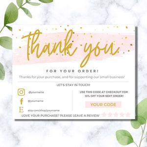 May include: Pink and gold thank you card with a watercolour background and gold glitter. The card includes social media icons and a discount code for 10% off your next order. The text reads "Thank you", "For your order!", "Thanks for your purchase, and for supporting our small business!", "Let's stay in touch!", "Use this code at checkout for 10% off your next order!", "Your code", "Love your purchase? Please leave a review."