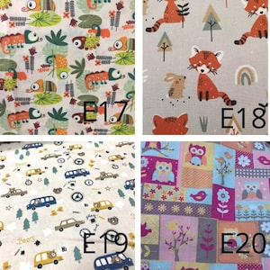 May include: Four fabric swatches with different patterns. One features colorful lizards and foliage, another has red foxes and a rainbow, a third shows cars and stars, and the last has owls, birds, and flowers. Each swatch has a white label with a number.