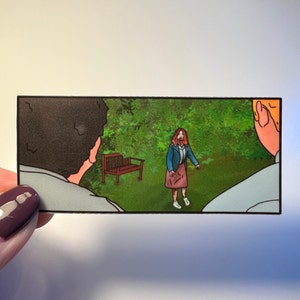 May include: A comic book panel illustration of three people in a green grassy area. A woman with red hair is standing in the middle of the panel, looking to the left. A man with brown hair is on the left side of the panel, looking to the right. A man with blonde hair is on the right side of the panel, looking to the left. There is a wooden bench in the background.