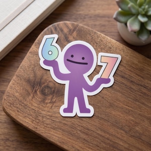 May include: A die-cut sticker featuring a purple cartoon character with a simple face holding a light blue gradient number 6 in one hand and a peach gradient number 7 in the other hand, all outlined in a thick white border against a wood background.