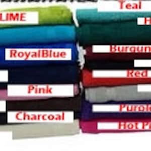 May include: A collection of folded rectangular towels in various colors including lime, aqua, royal blue, navy, pink, brown, charcoal, beige, teal, hunter green, burgundy, black, red, silver, purple, and hot pink, each labeled with its color name.