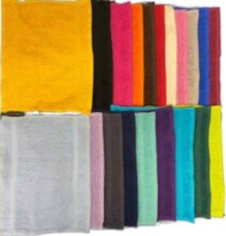 May include: A collection of rectangular fabric swatches in a wide variety of solid colors including yellow, black, pink, orange, brown, red, cream, light pink, beige, blue, maroon, gray, lavender, charcoal, navy, mint, purple, teal, dark green, and lime.