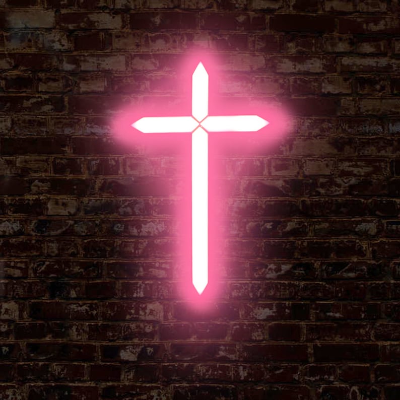May include: A pink neon cross on a brick wall background.