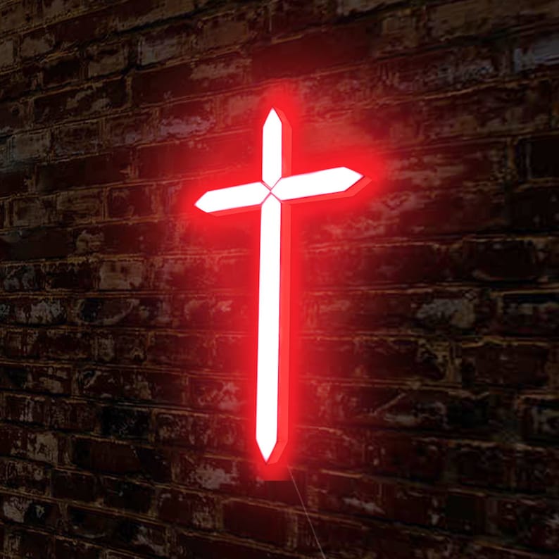 May include: A white cross with a red neon glow, mounted on a brick wall.