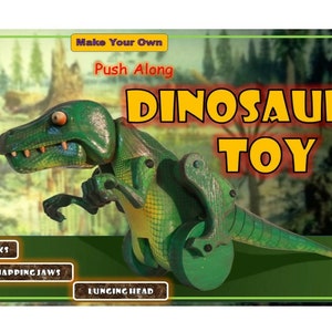 May include: A green and yellow push-along dinosaur toy. The image includes the words "DINOSAUR TOY". The toy has wheels and features that include walking, snapping jaws, and a lunging head.