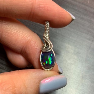 Silver wire-wrapped black opal pendant