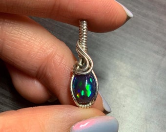 Silver wire-wrapped black opal pendant