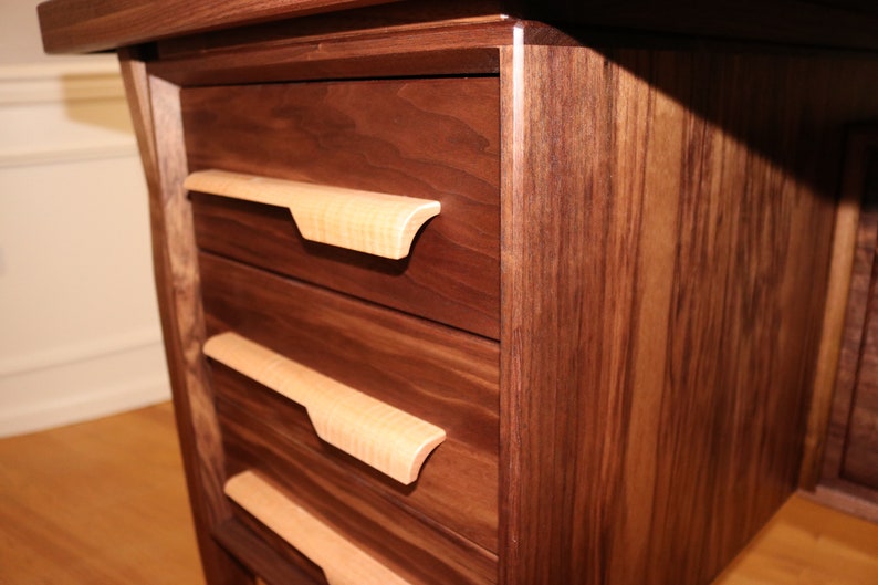 Detail photo showing the standard figured maple handles