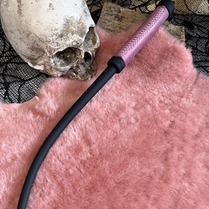 Pink leather wrapped handle  rubber whip