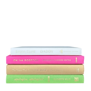 May include: A stack of four hardcover books with gold lettering. The top book is white with "EMMA CLINE DADDY" on the cover. The second book is pink with "ON THE ROOFTOP" on the cover. The third book is tan with "The Years That MATTER MOST" on the cover. The bottom book is green with "apologize, apologize!" on the cover.
