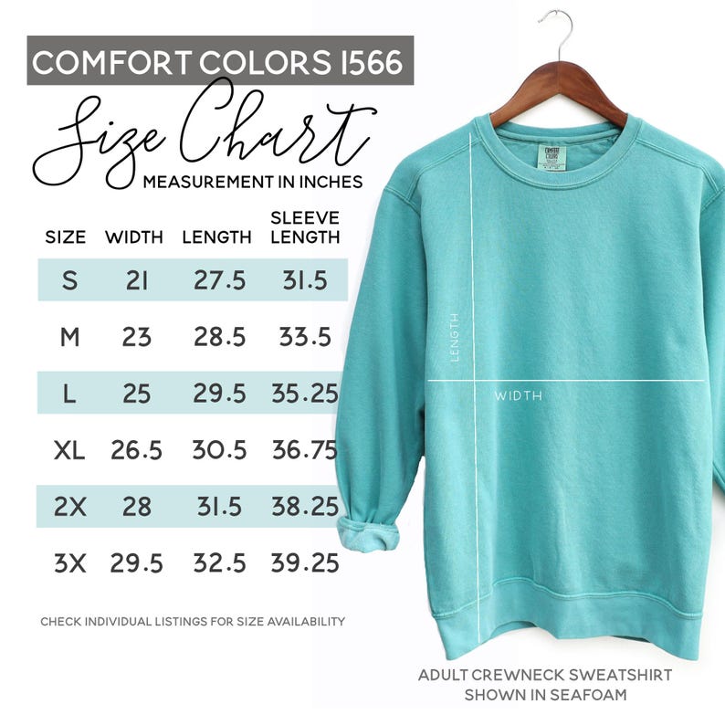 May include: A seafoam green adult crewneck sweatshirt displayed on a wooden hanger. The image includes a size chart with measurements in inches for width, length, and sleeve length. The size chart includes sizes S, M, L, XL, 2X, and 3X.