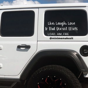 May include: White Jeep with a black decal on the rear window that reads "Live, Laugh, Love If That Doesn't Work LOAD, AIM, FIRE @minimemakesit"