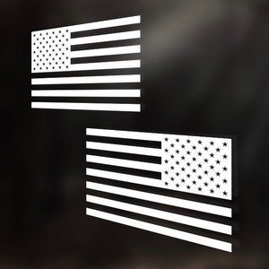 May include: Two white vinyl American flag decals. The flags are in a traditional design with red and white stripes and blue stars.