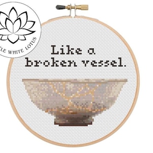 May include: Cross stitch pattern for a hoop with a white background and a grey and gold bowl with the text "Like a broken vessel." The pattern is labelled "Level - Medium" and is a digital download product compatible with Pattern Keeper software.