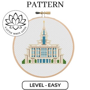 May include: Cross stitch pattern of a white building with a tall spire, surrounded by green bushes. The pattern is labeled "Level - Easy" and is compatible with Pattern Keeper software. The pattern is from A Little White Lotus.
