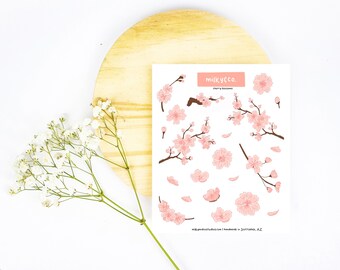 Pode incluir: Uma folha de adesivos de flores de cerejeira rosa com o texto "milkyco. cherry blossoms" e "milkycostudios.com handmade in Scottsdale, AZ".