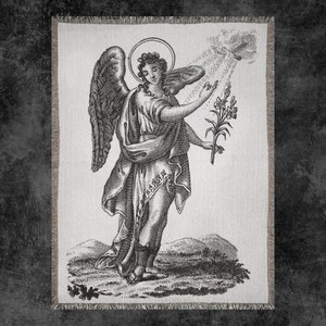 May include: A black and white illustration of an angel with wings holding a bouquet of lilies. The angel is wearing a long robe and has a halo above its head.