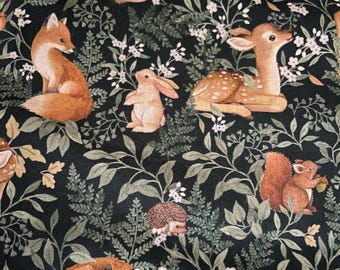 May include: Dark green fabric with a repeating pattern of woodland animals and foliage. The design includes foxes, deer, rabbits, squirrels, hedgehogs, and owls, with white flowers and green leaves. The animals are in shades of brown and orange.