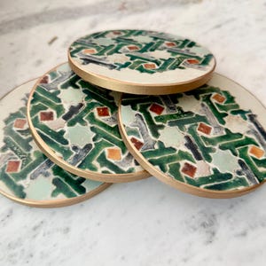 May include: A set of three ceramic mugs with a speckled, matte finish. The mugs are in shades of cream, light gray, and dark gray. Each mug has a simple, minimalist design, perfect for coffee or tea.