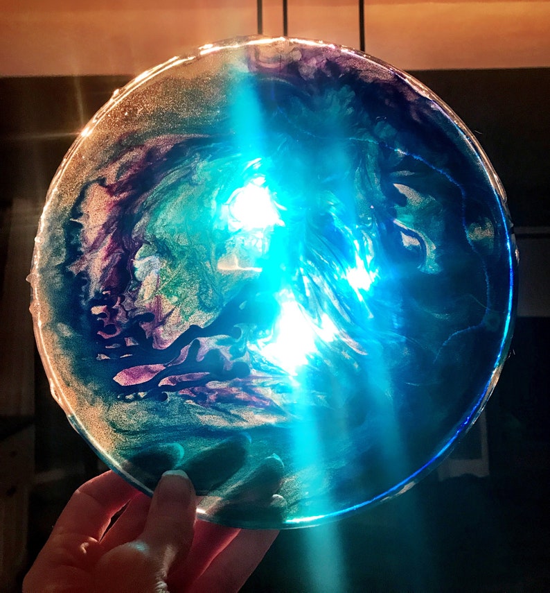 Swirl art decorative resin plate or suncatcher.