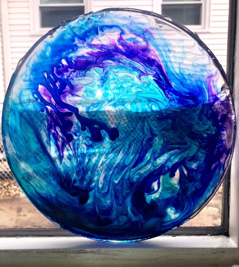 Swirl art decorative resin plate or suncatcher.