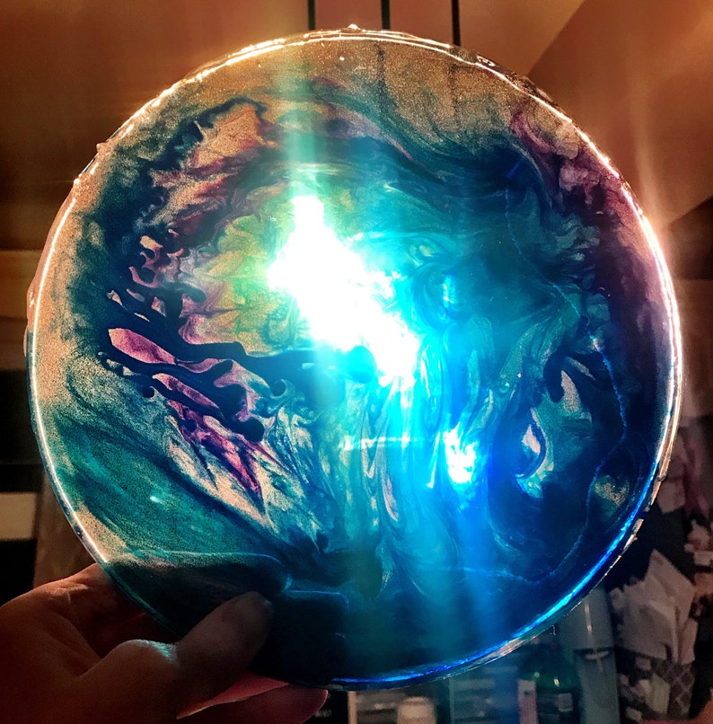 Swirl art decorative resin plate or suncatcher.