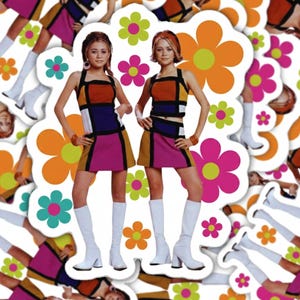 May include: A sticker sheet featuring two women in 1960s-inspired outfits. The outfits include a colour-block top and skirt, paired with white boots. The background is filled with flower shapes in orange, pink, and green.