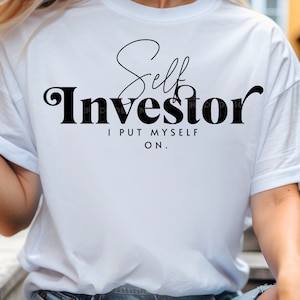May include: White t-shirt with black text that reads "Self Investor I Put Myself On."