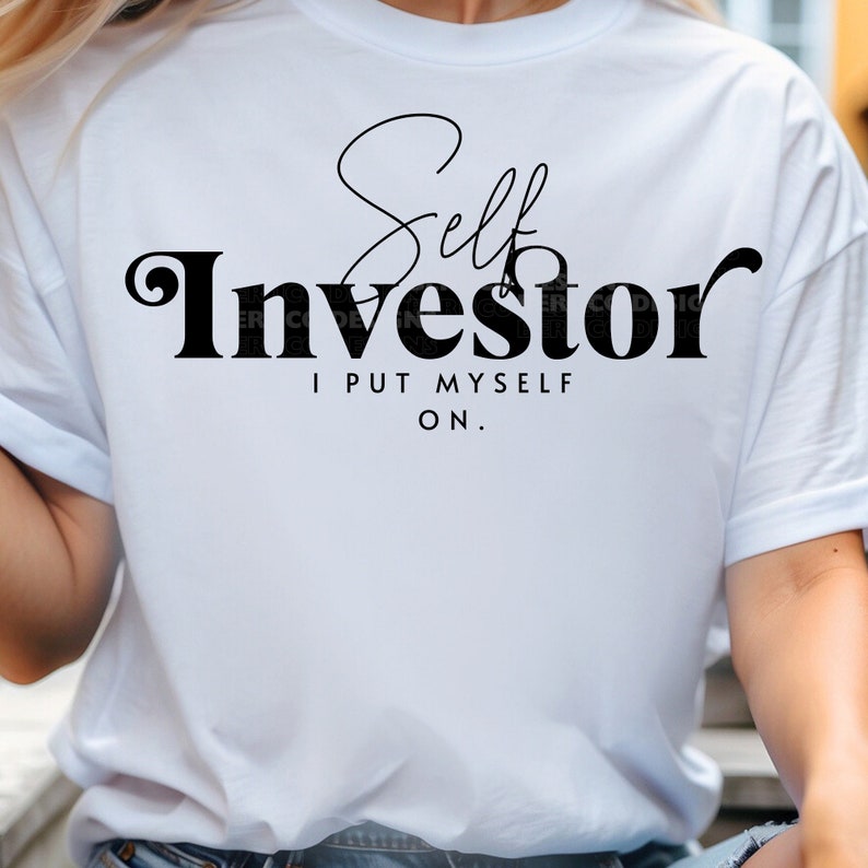 May include: White t-shirt with black text that reads "Self Investor I Put Myself On."