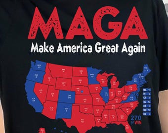 May include: Black t-shirt featuring the words "MAGA Make America Great Again" in red and white. The design includes a map of the USA, with states coloured red and blue, and electoral vote numbers.