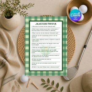 May include: A rectangular Masters Trivia game card featuring a green and white gingham border and twelve numbered questions about the golf tournament. The card is centered on a woven circular mat with golf balls and a club nearby.
