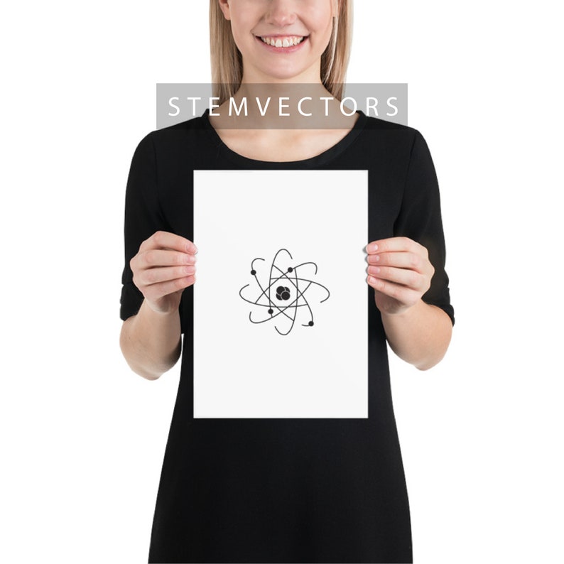 May include: A white poster with a black atom illustration. The poster is being held by a person wearing a black dress.