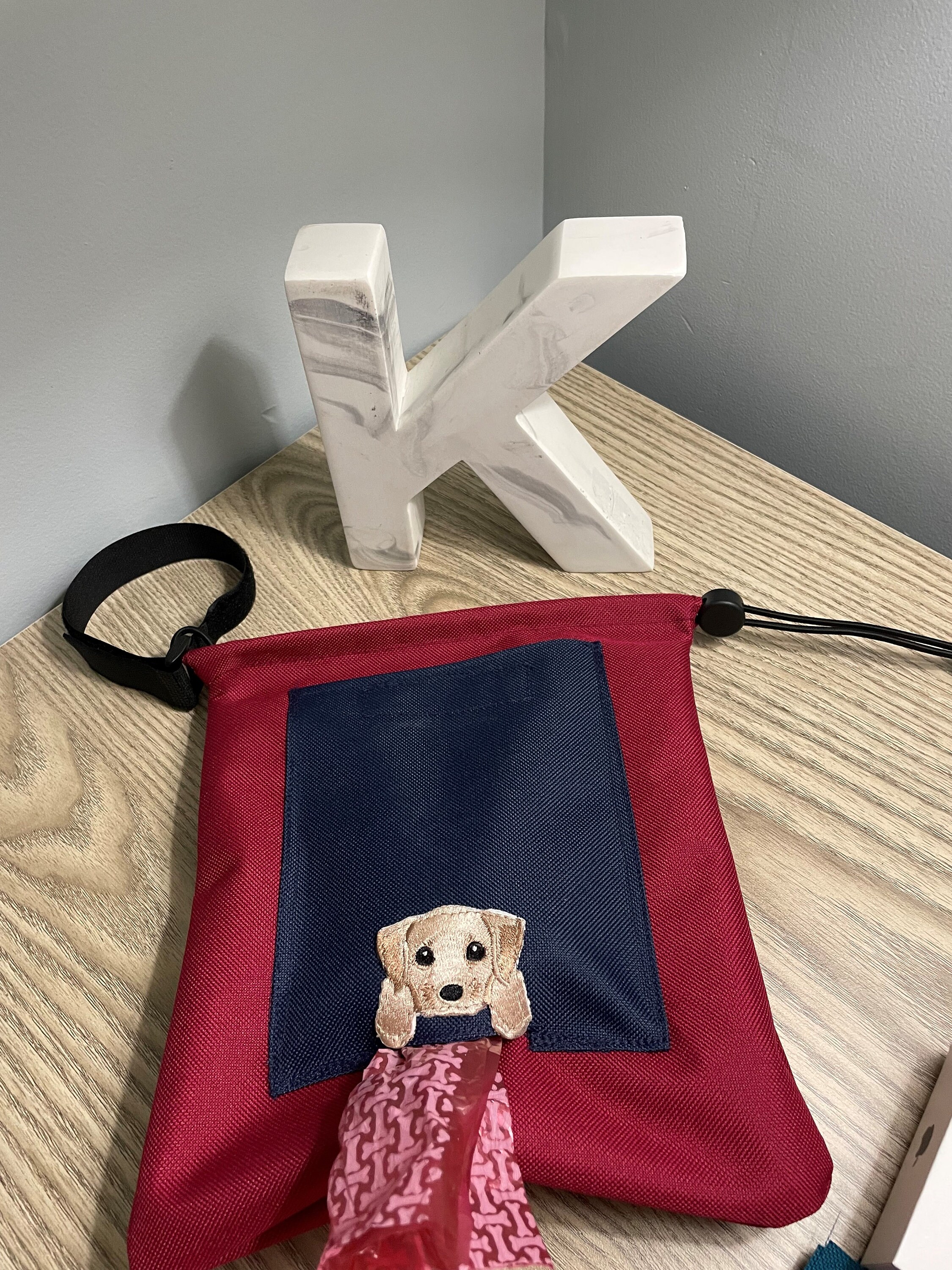 Dog waste carrier and disposable bag all in one. Attaches to Etsy